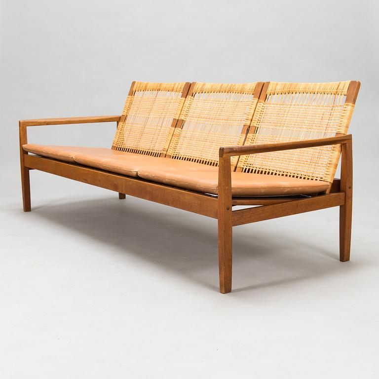 Hans Olsen, A teak and rattan sofa for Juul Kristensen, Denmark, late 1950s.