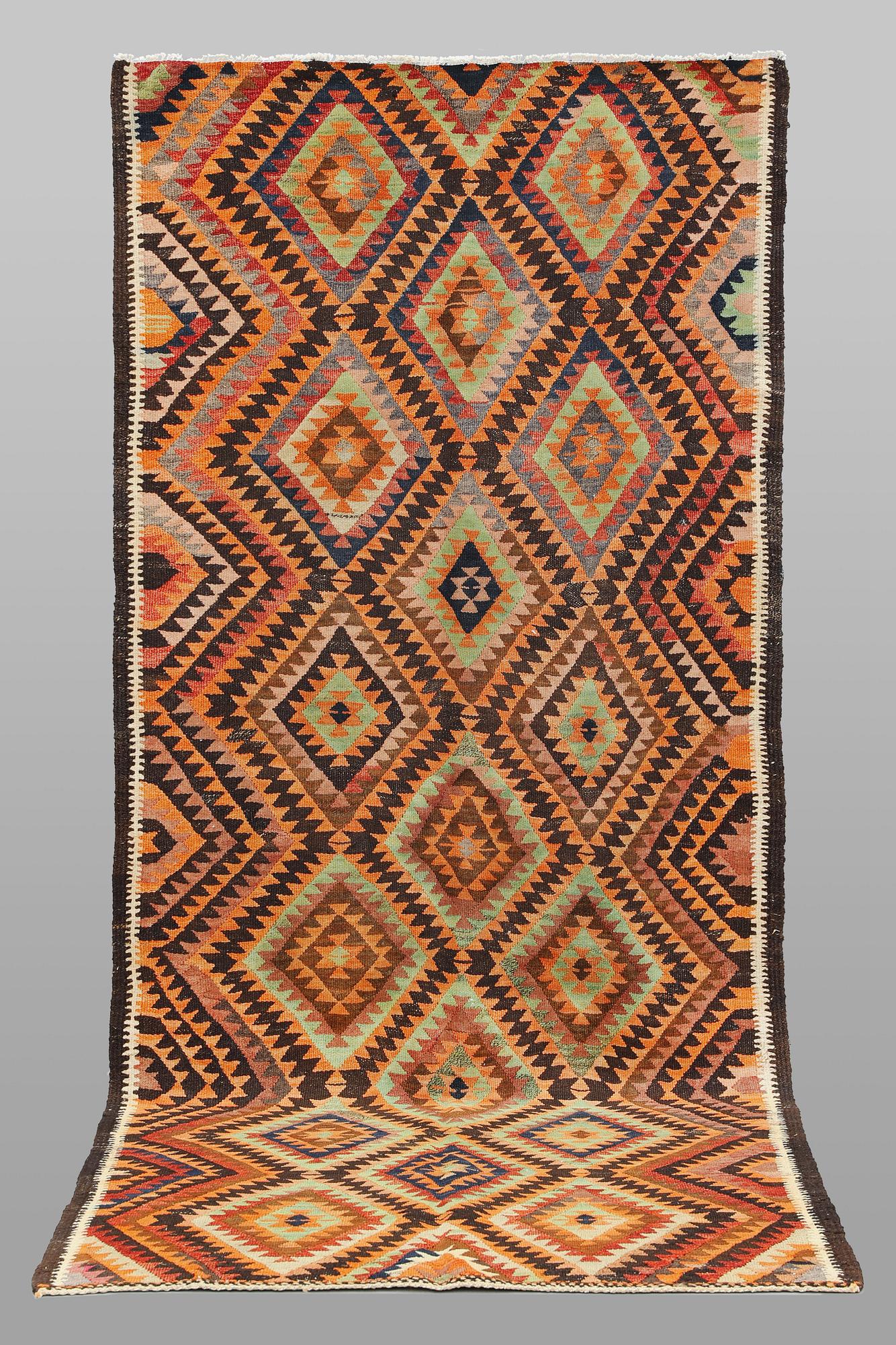 A  Persian nomadic Kilim rug, approx. 300 x 143 cm.