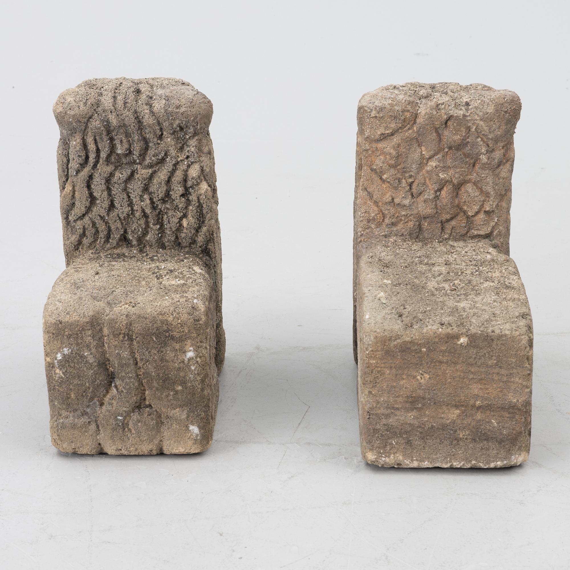 A set of two lion garden sculptures.