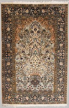 A Kashmir carpet, silk on cotton warp. Circa 185 x 125 cm.
