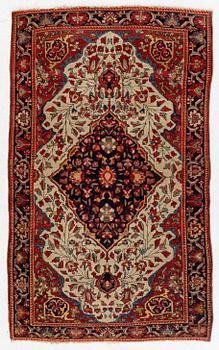 An antique Sarouk rug Western Iran, c 160 x 96 cm.