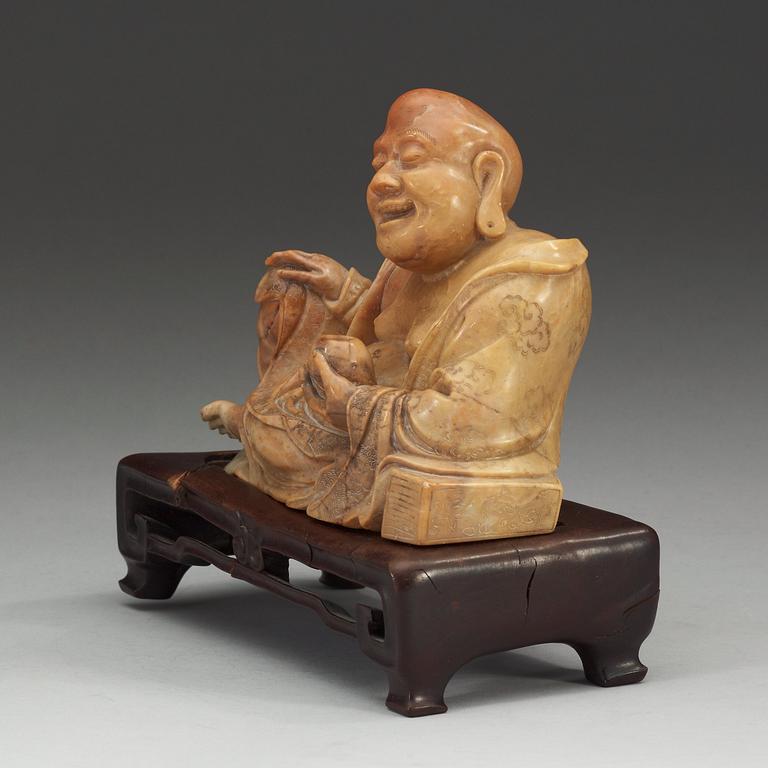 A stone figure of Budai, presumably late Qing dynasty (1644-1912).