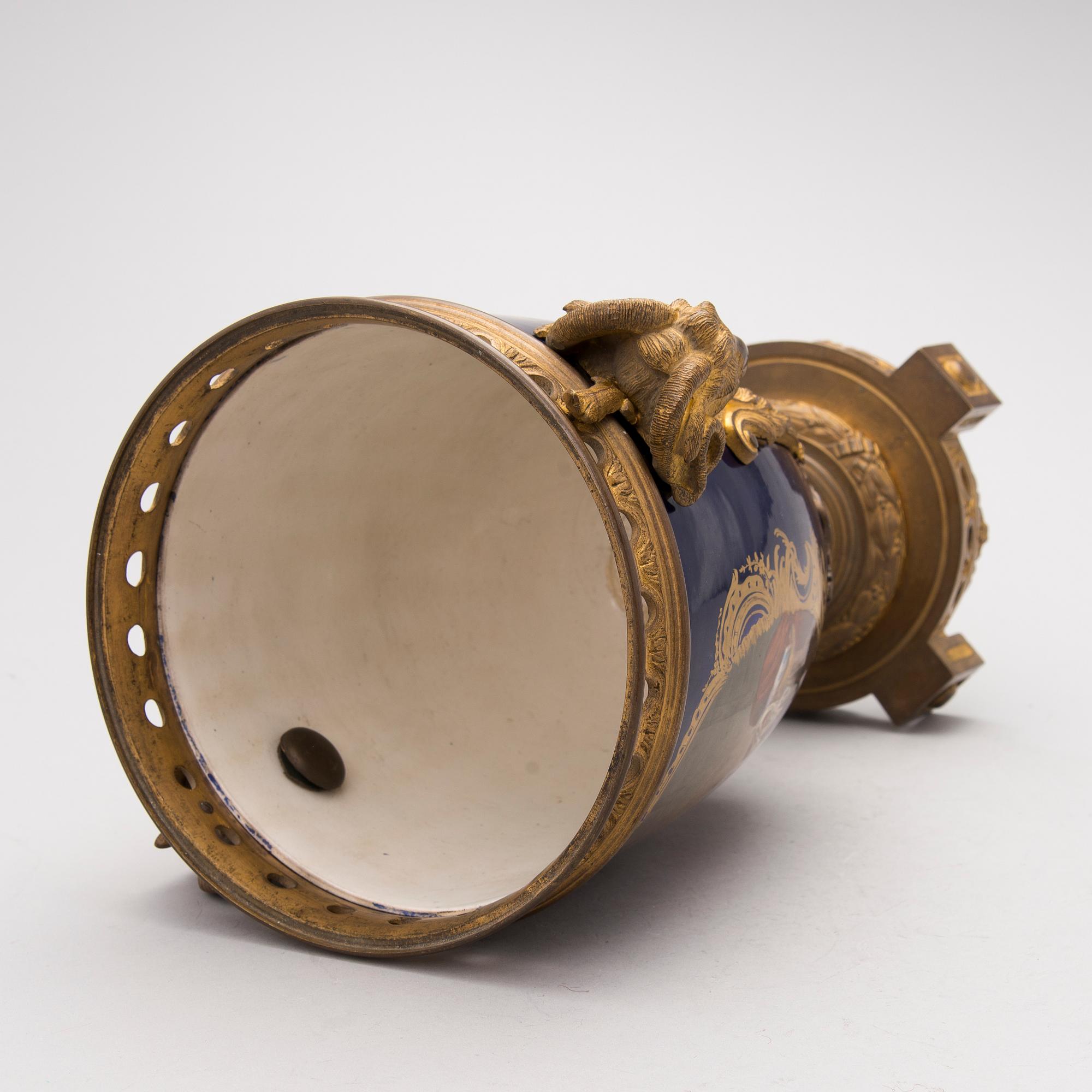 A FRENCH SÈVRES STYLE URN, porcelain and gilt bronze, latter half of the 19th century.