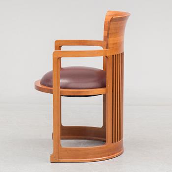 FRANK LLOYD WRIGHT, A cherry wood 'Barrel chair' from Cassina, late 20th century.
