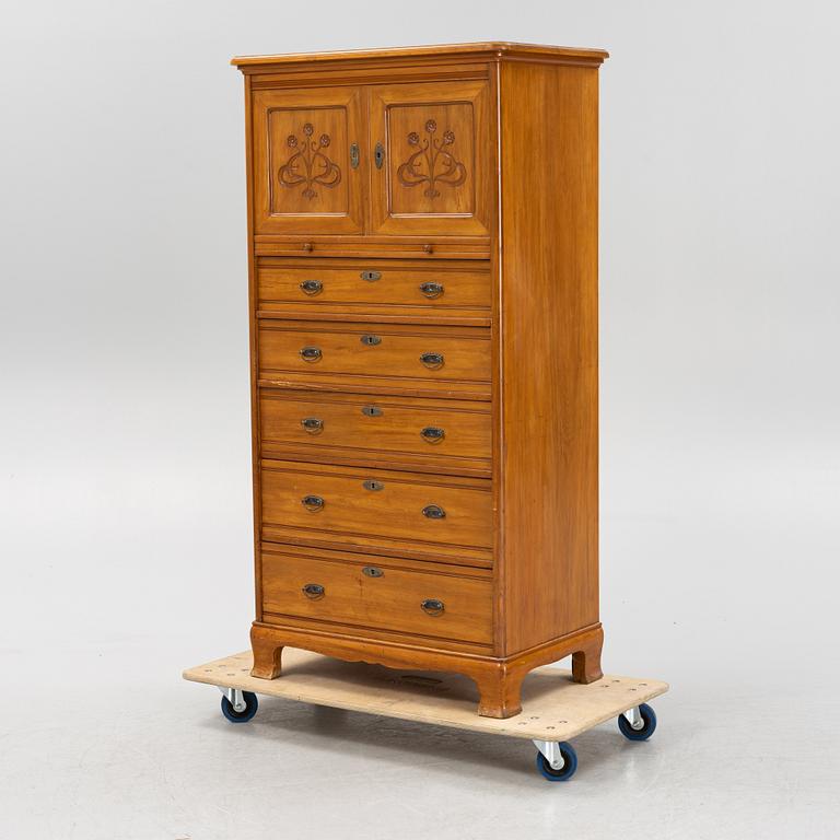 A walnut veneered tall boy dresser, early 20th century.