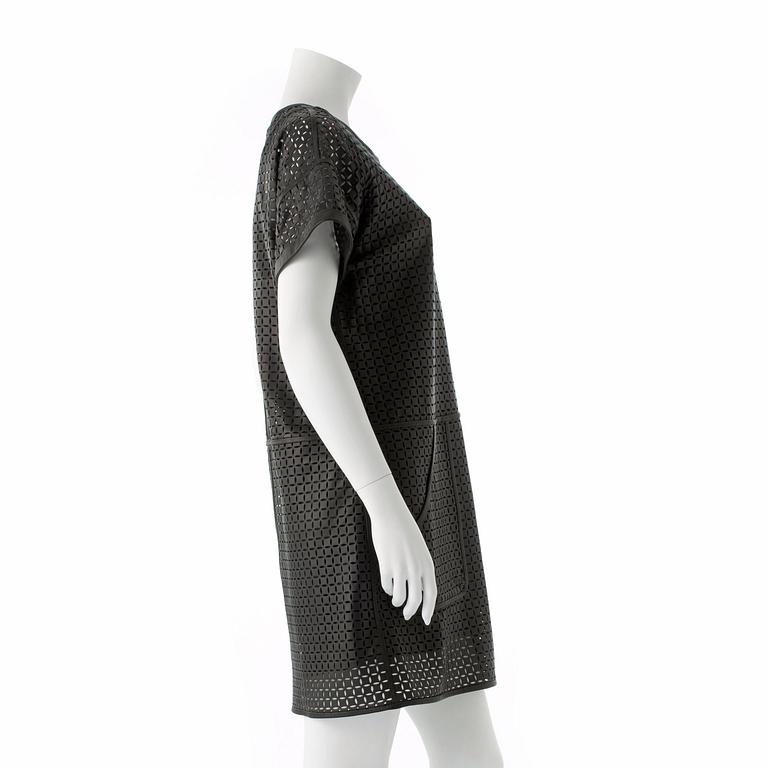 ESCADA SPORT, a black openwork leather dress.