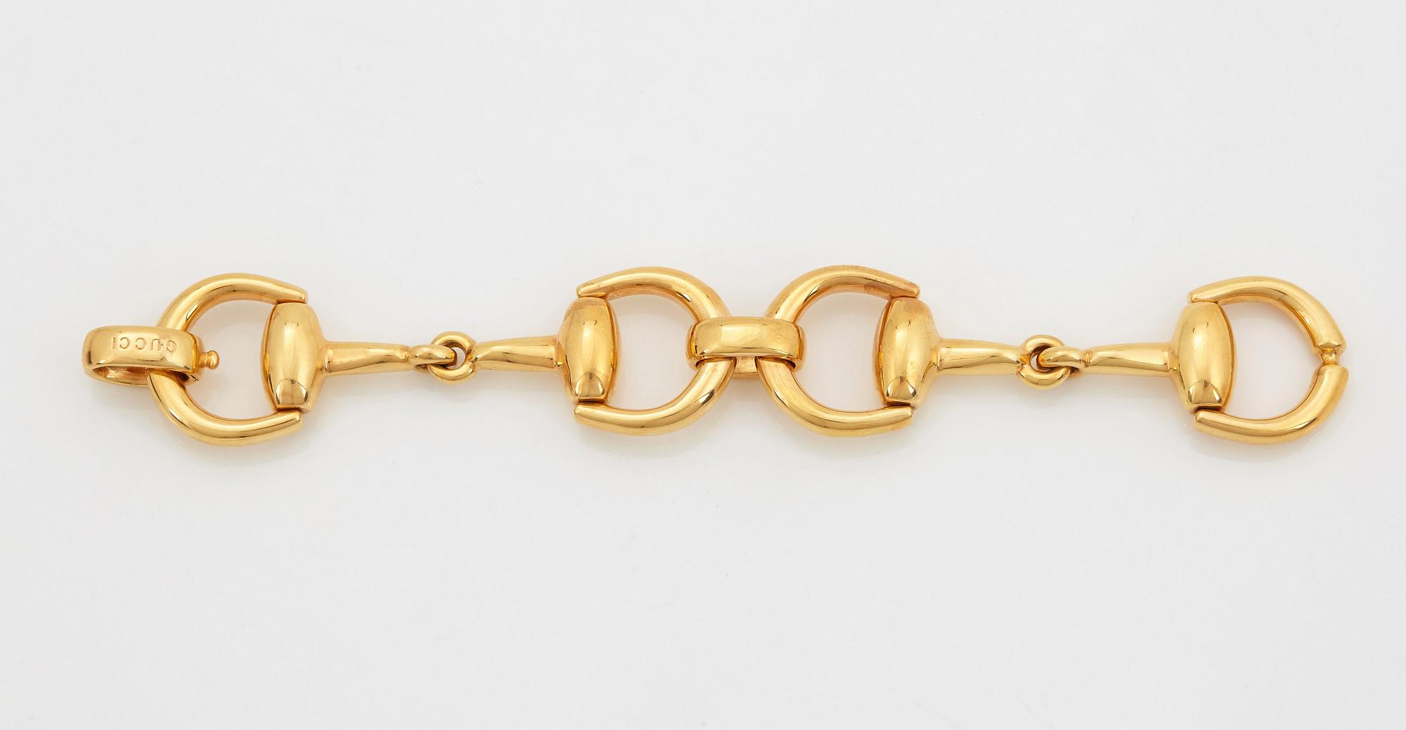 An 18K gold Gucci bracelet.