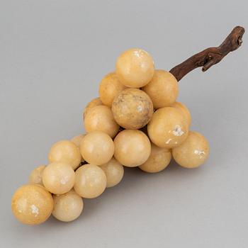 13 stone table decorations of grapes, 20th century.