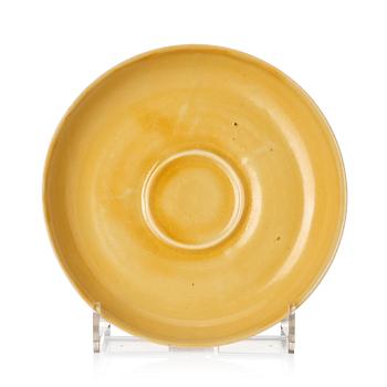 1165. A yellow glazed cup holder, Qing dynasty with Xuandes four character mark.