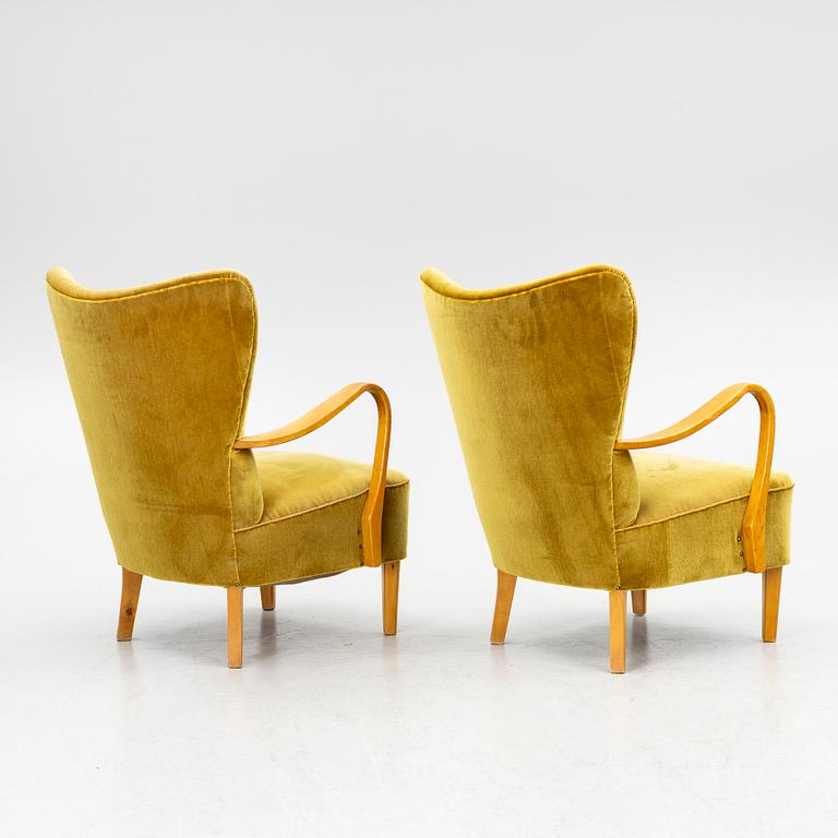 A pair of wingback armchairs, Sweden, first half of the 20th century.