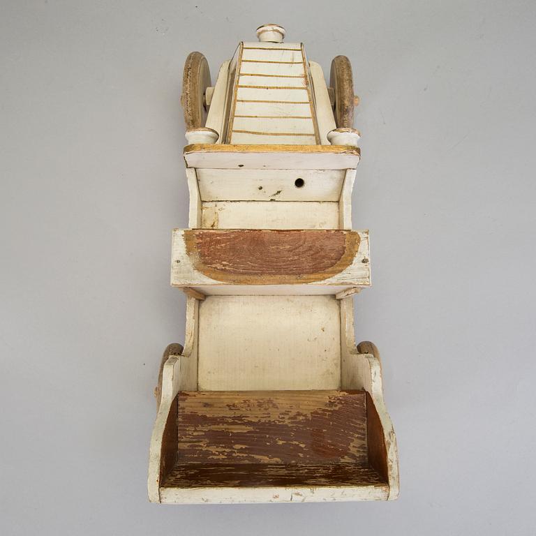 A painted wooden toy car c. 1910.