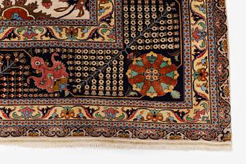 A semi-antique Tabriz carpet, Northwest Persia, of Safavid 'Vase' design, c.328 x 242 cm.