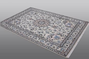 A rug, Nain, part silk, 238 x 163 cm.