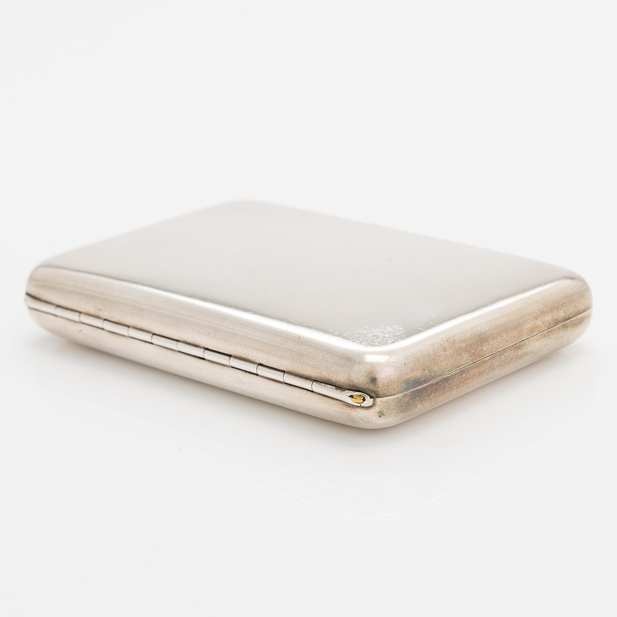 A silver cigarette case, Hlebnikov,  Imperial warrant, unidentified maker's mark, Moscow 1899-1908.