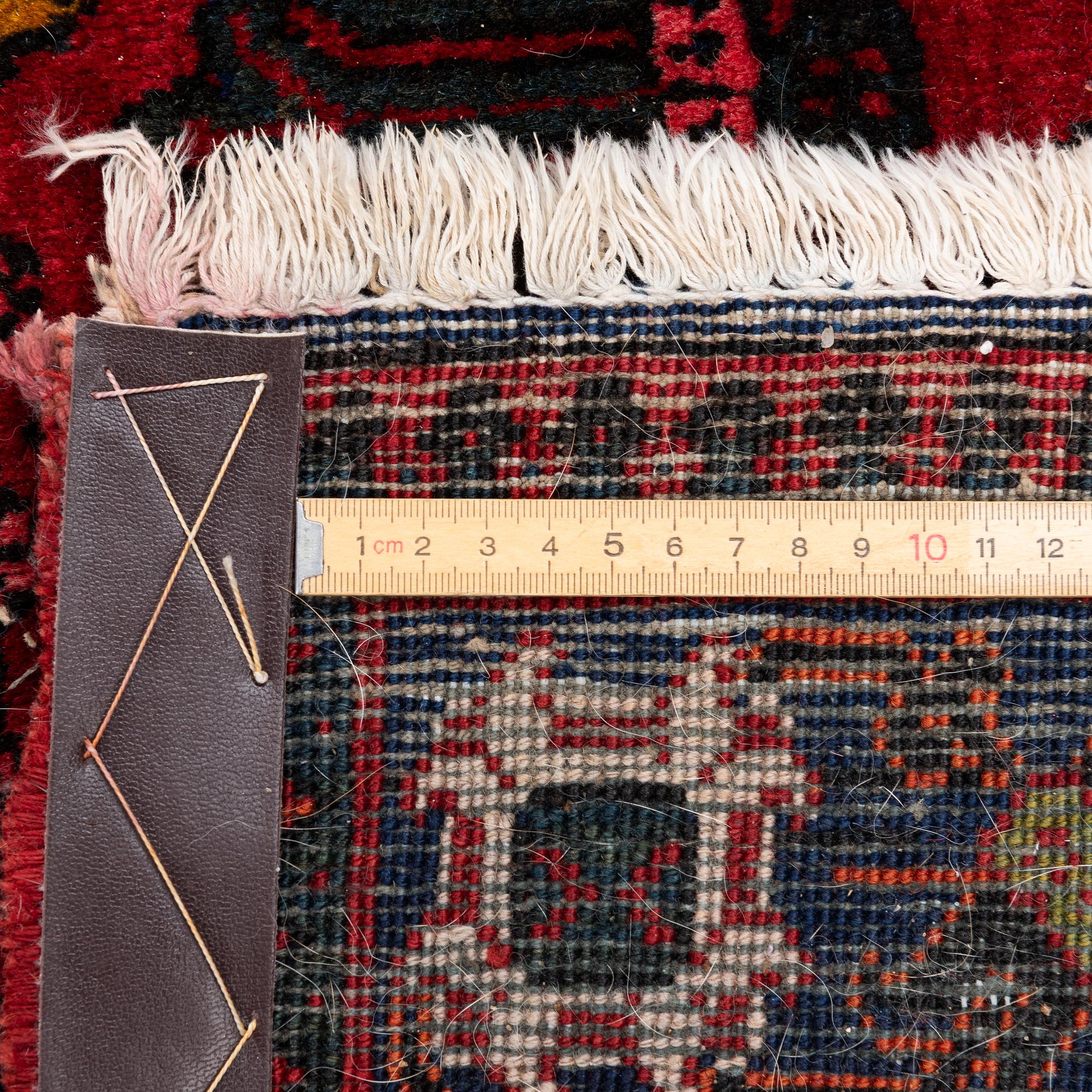 An oriental rug, c. 365 x 285 cm.