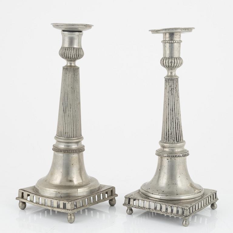 A matched pair of pewter candle sticks, 19th Century.