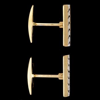 A pair of gold cufflinks.