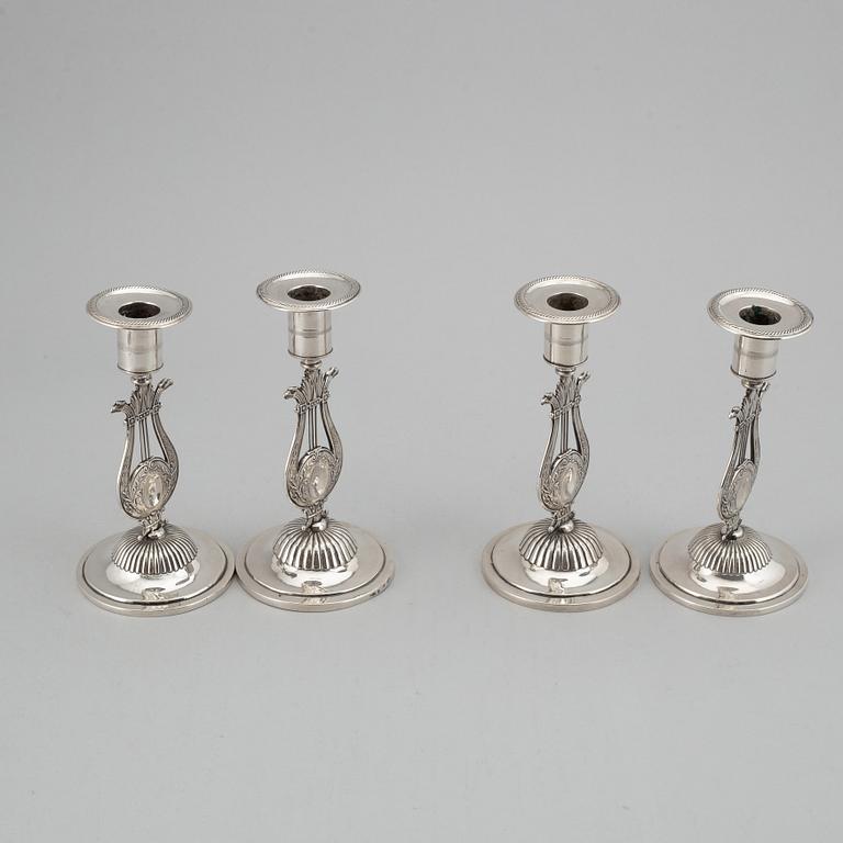 A Swedish 19th century matched set of four silver candlesticks, mark of Johan Petter Grönvall, Stockholm 1824.