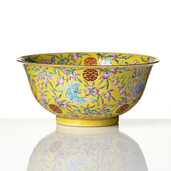 A yellow glazed 'nine bats and peaches' bowl, late Qing dynasty with Guangxu mark.