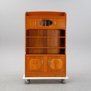 An oak cabinet and bookcase, early 20th Century.