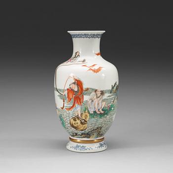 303. A famille rose vase decorated with four of the eight immortals (ba xian), Republic with Yongzheng four character mark.