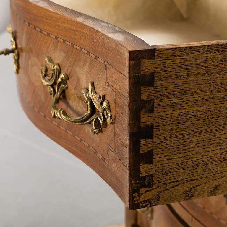 A rococo style chest of drawers.