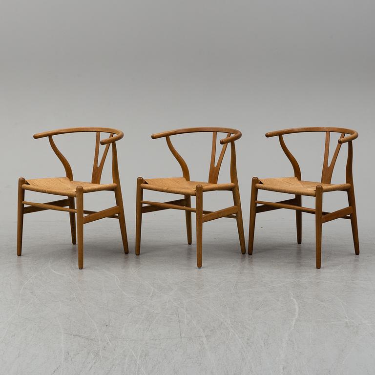 Three armchairs, 'Wishbone Chair' by Hans J Wegner, Carl Hansen & Son, Odense, Denmark.