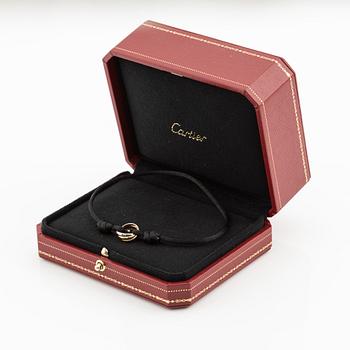 Cartier armband "Trinity", 18K trefärgat guld och textil.