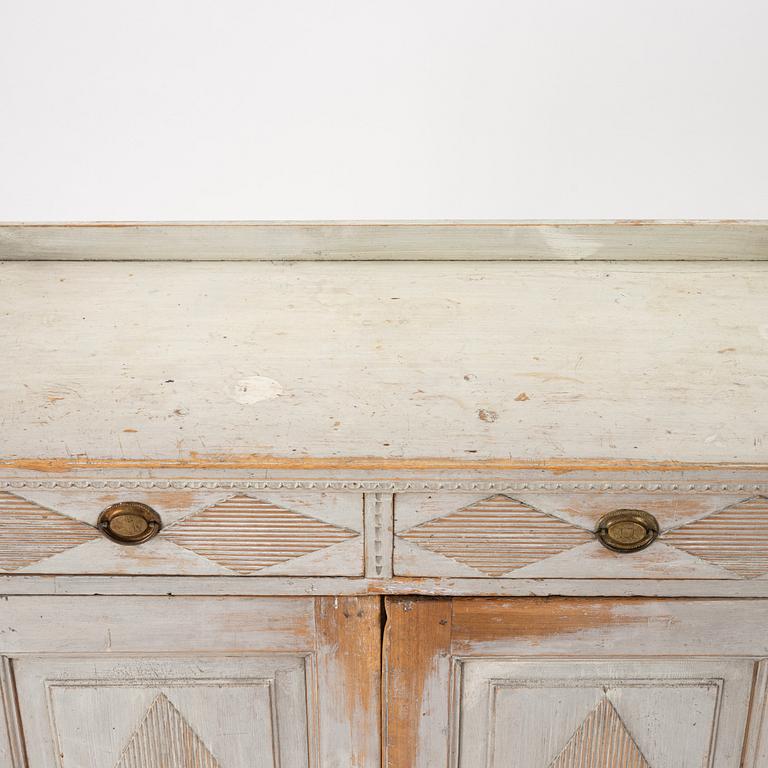 A late Gustavian grey lacquered pine cabinet, Sweden ca 1800.