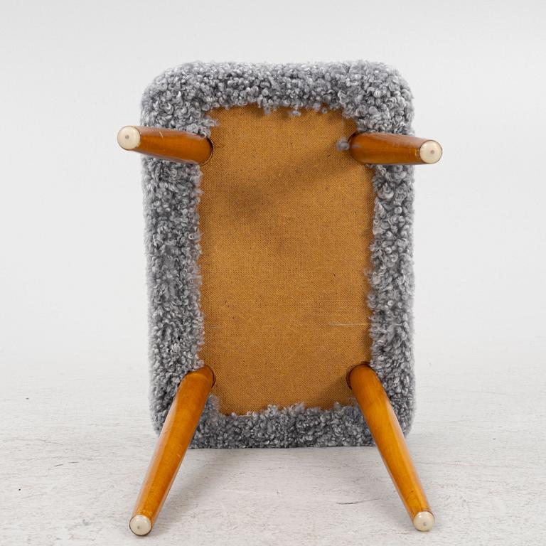 A sheepskin upholstered stool, second part of the 20th century.