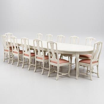 A Rococo style dining table and twelve chairs, KA Roos, Helsingborg, modern production.