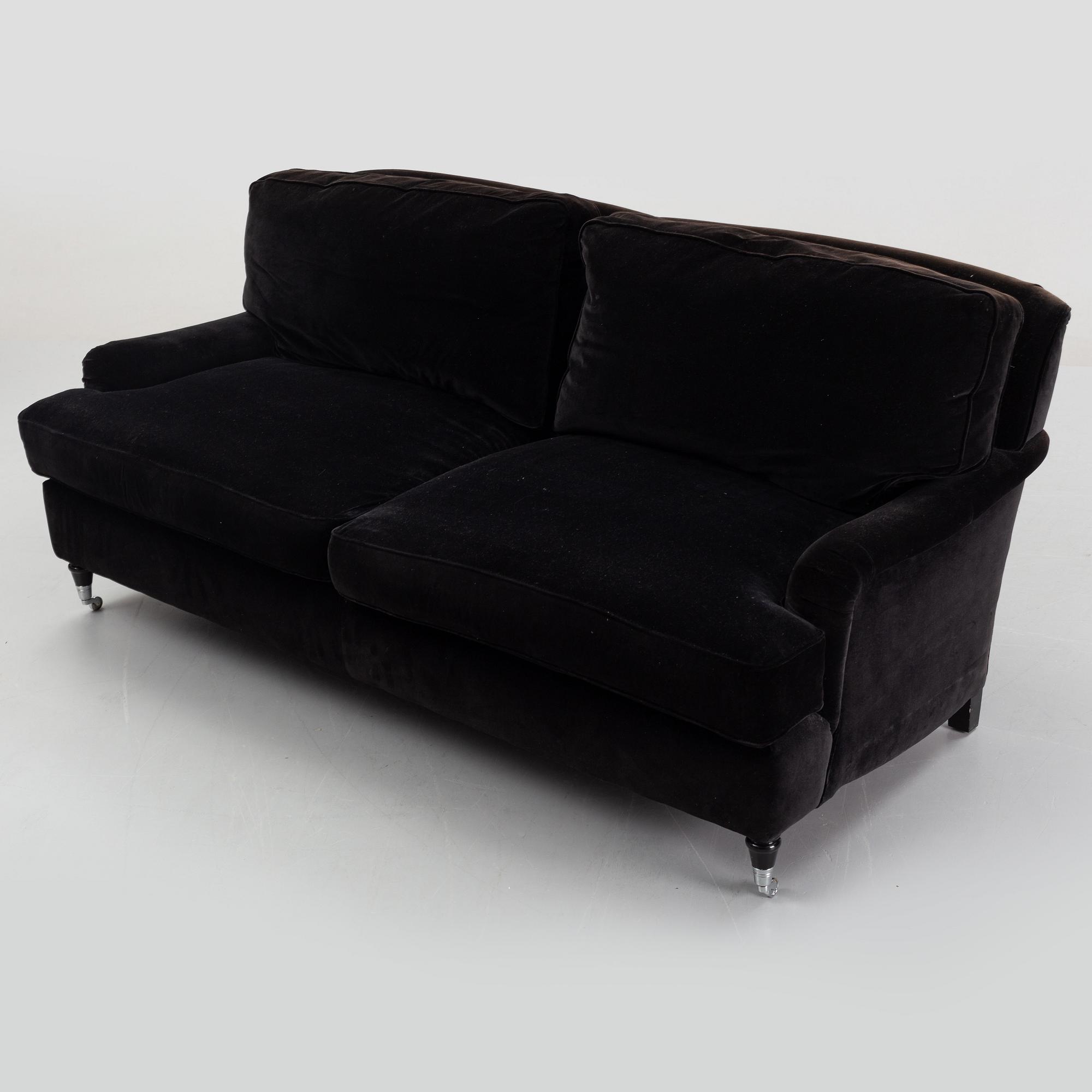 A contemporary velvet Howard sofa.