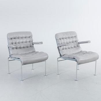 A COUPLE OF BRUNO MATHSSON ARMCHAIRS.