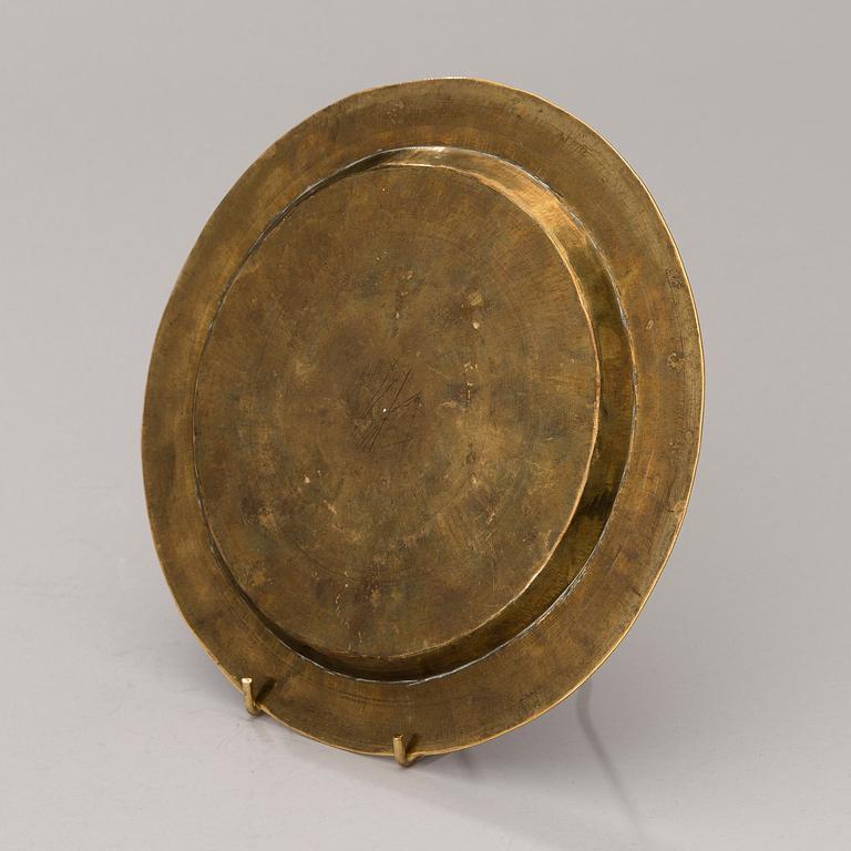 A Middle Eastern brass, silver and copper plate ca 1900.