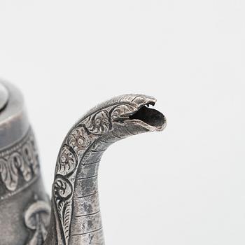 An Indian silver teapot.