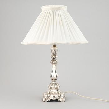 A silver plate neo-rococo tablelamp by CG Hallberg.