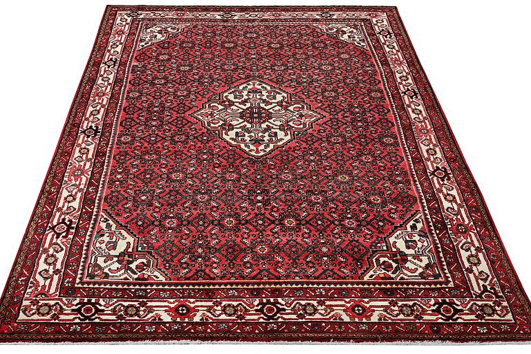 A Hosseinabad carpet, c. 310 x 210 cm.