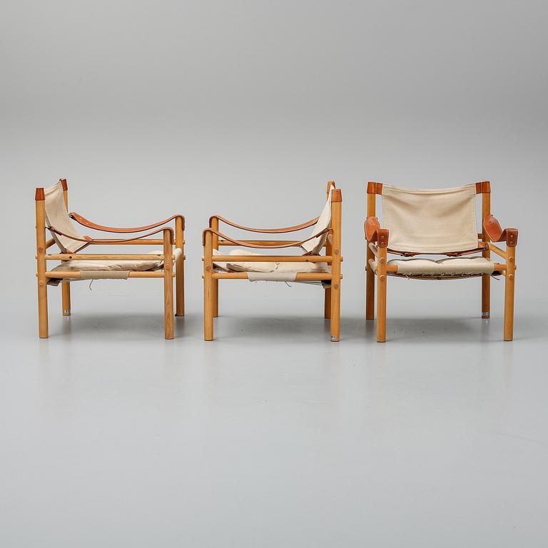 Arne Norell, a set of three "Sirocco" armchairs and two tables, Norell.