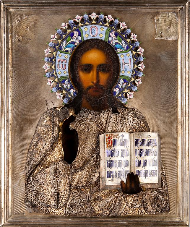 IKON med silverrisa samt emaljerad gloria, olja på pannå, Moskva 1908-1917.