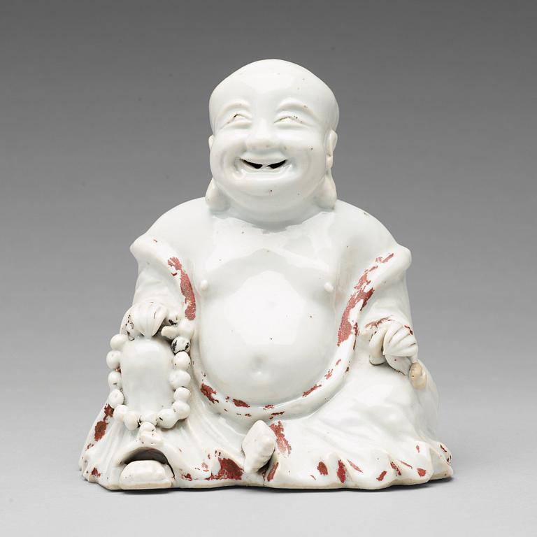 A blanc de chine figure of Buddai, Qing dynasty, 18th Century.