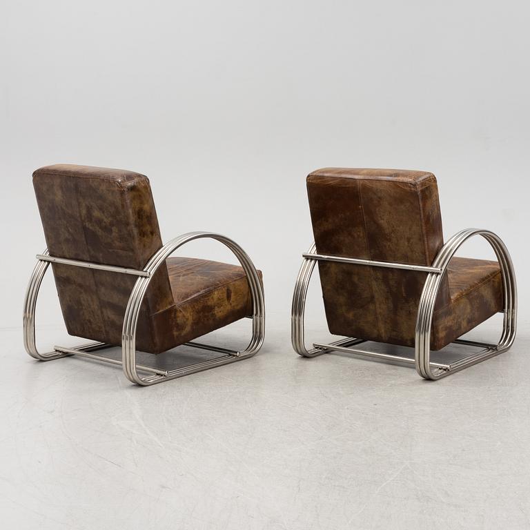 A pair of 'Hudson Street' lounge chairs from Ralph Lauren home.