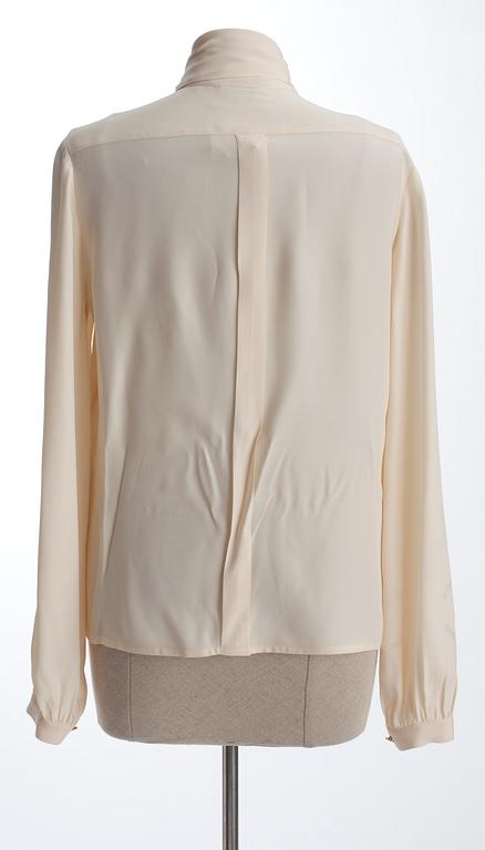 A Chanel silk blouse.