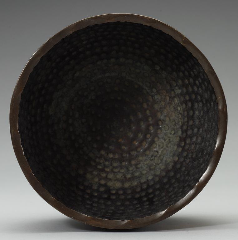 A Japanese bronze sculpture with a bowl, Meiji.