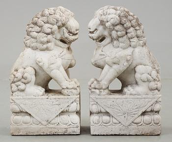 A pair of marble figures of 'Buddhist Lions', China.