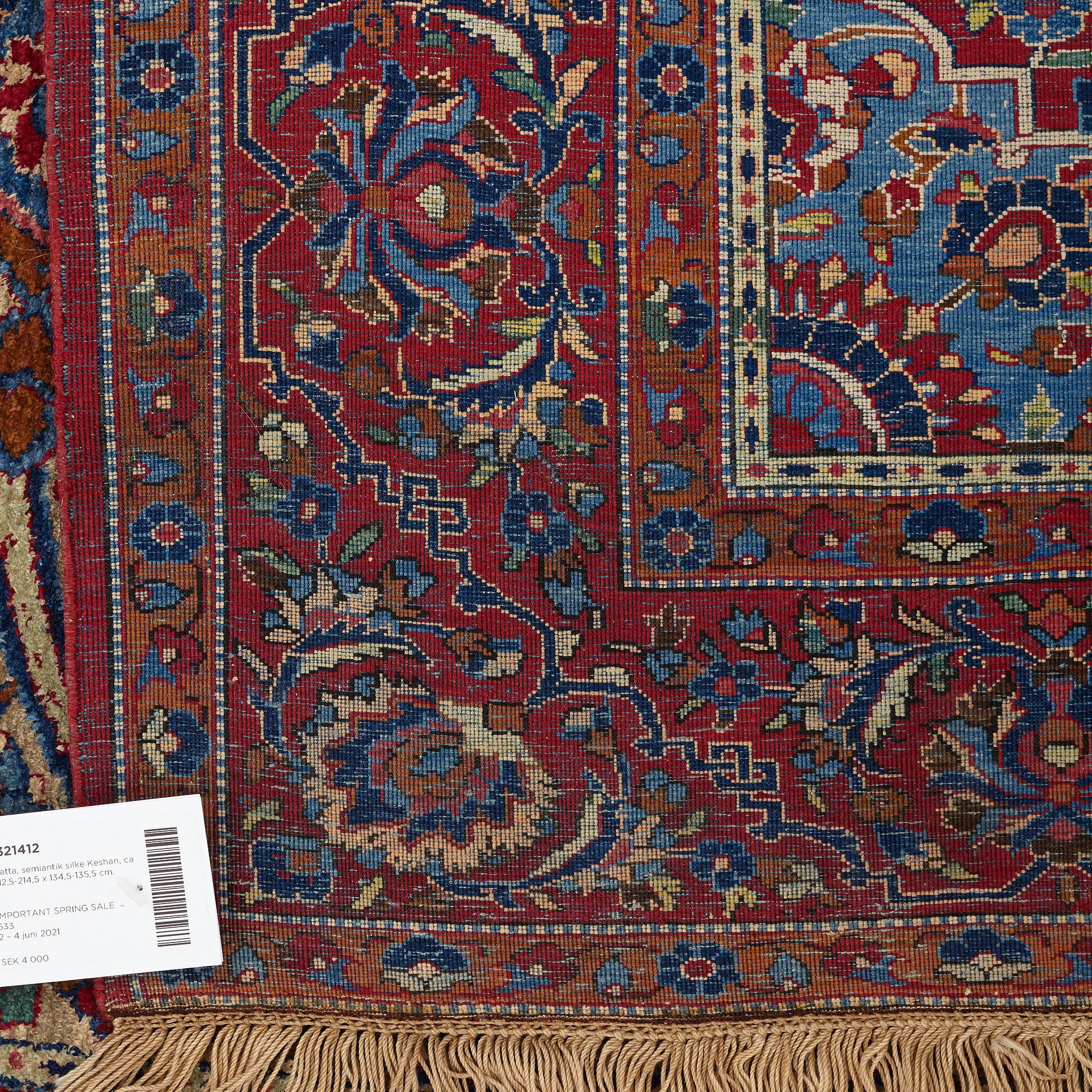 Matto, a semi-antique silk Kashan, ca 212,5-214,5 x 134,5-135,5 cm.