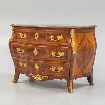 A Swedish rococo parquetry and gilt-bronze mounted commode in the manner of C. W. Hein, later part of the 18th century.