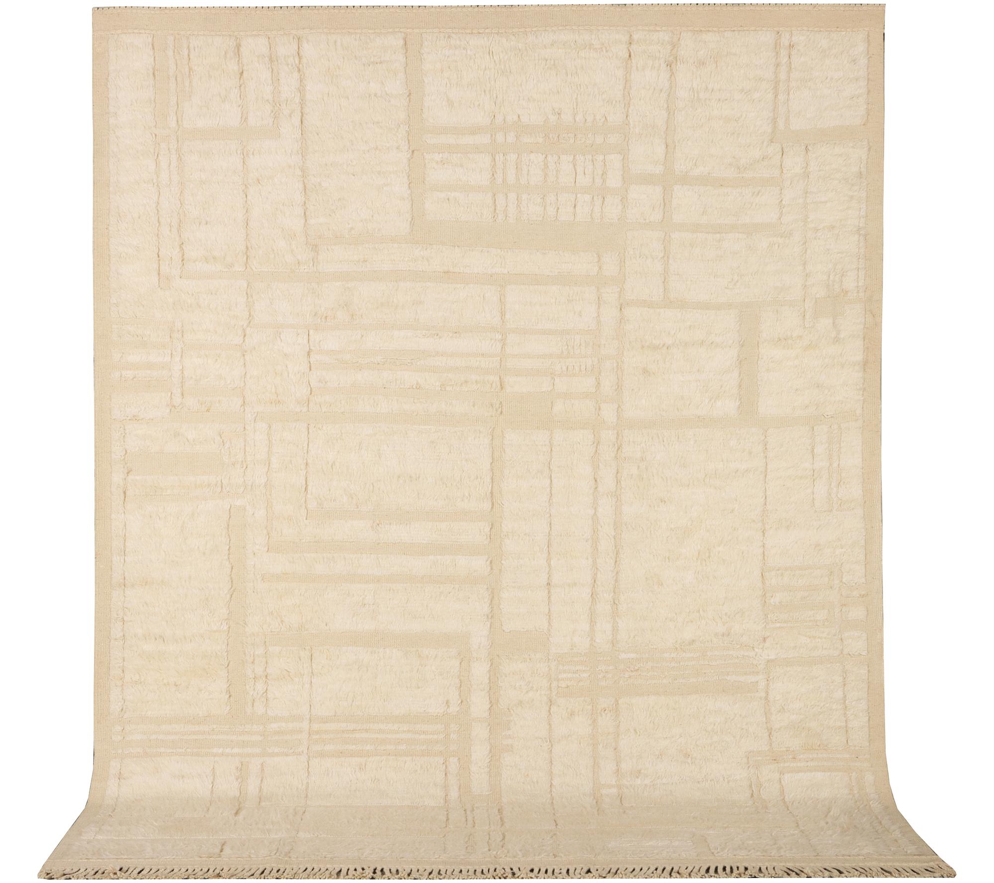 A relief-cut Moroccan carpet, c. 321 x 251 cm.