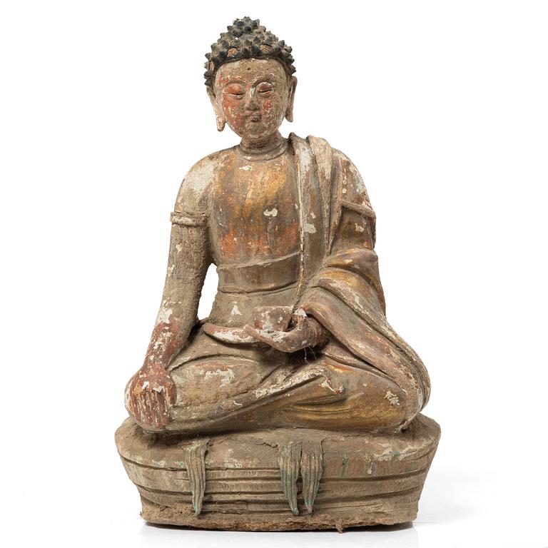 A Southeast Asian figure of a Buddha, 20th century.