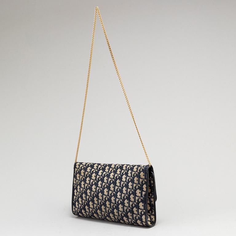 CHRISTIAN DIOR, a set of a clutch, a belt and an umbrella.