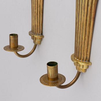 Lars Holmström, a pair of Swedish Grace brass wall sconces, Arvika, 1920's.